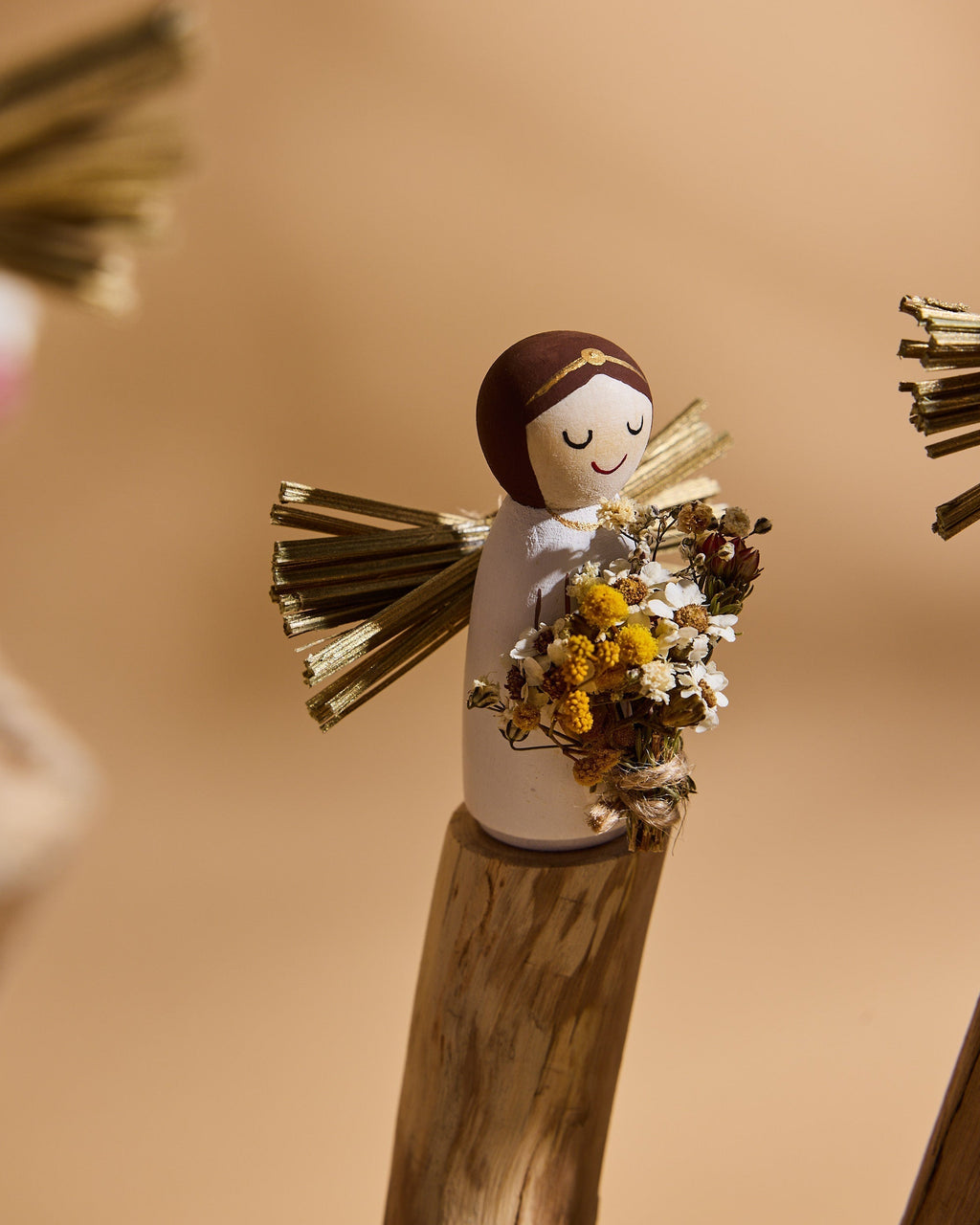 Handcrafted wooden angel symbolising hope, kindness and comfort in modern life.