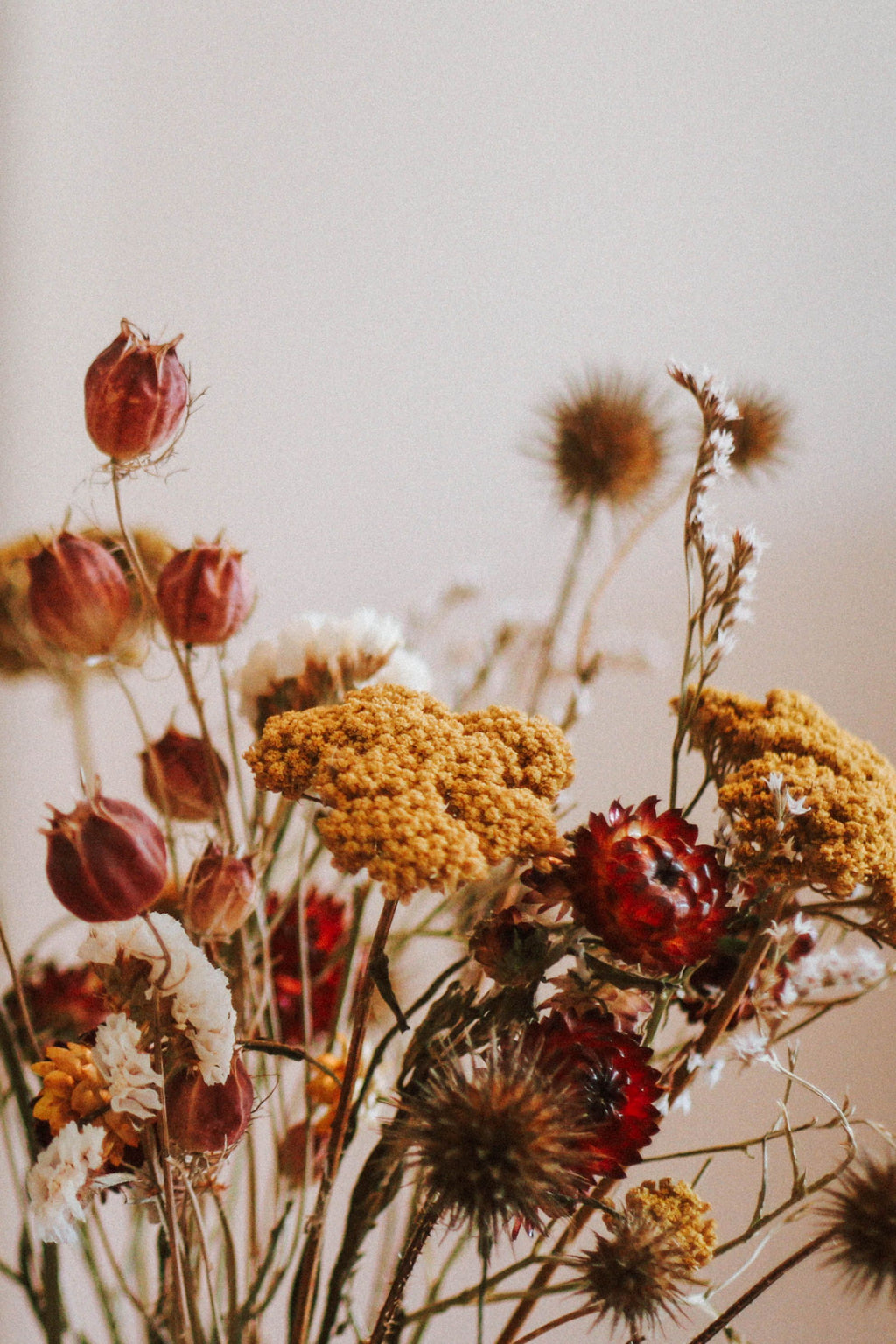 Preserved dried flower bouquet in warm autumn tones inspired by flowers used in The Giving Angel handcrafted sympathy gifts.