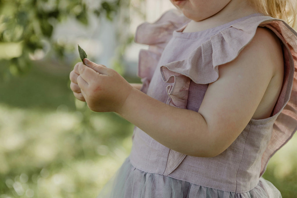 Young child exploring nature, representing safe, happy childhoods and brighter futures for Australian children.