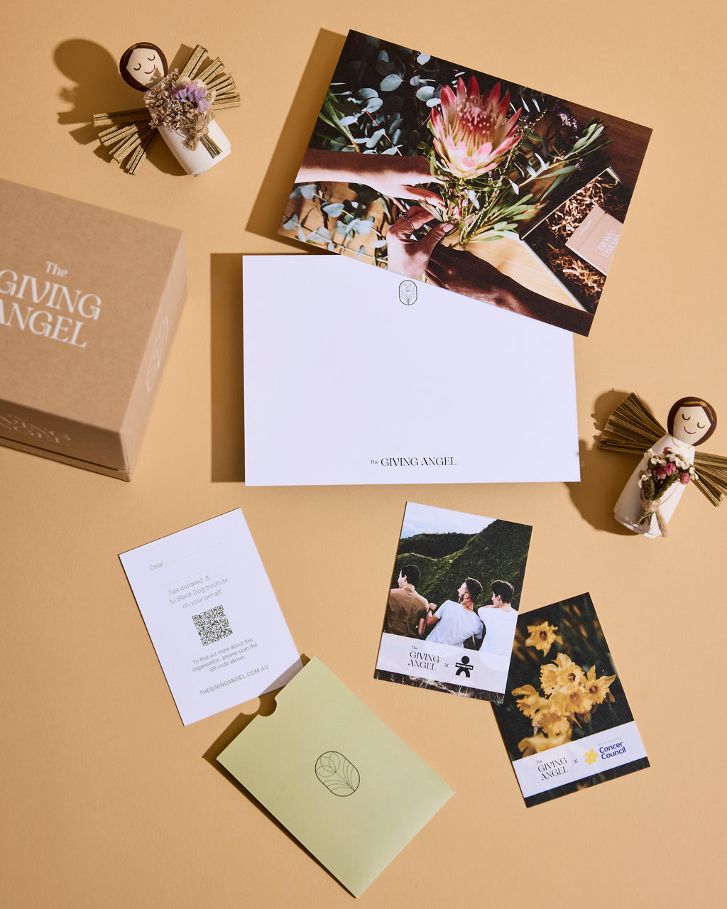 The Giving Angel gift box with handcrafted angel keepsake, personalised message card and charity donation cards included with each meaningful gift.