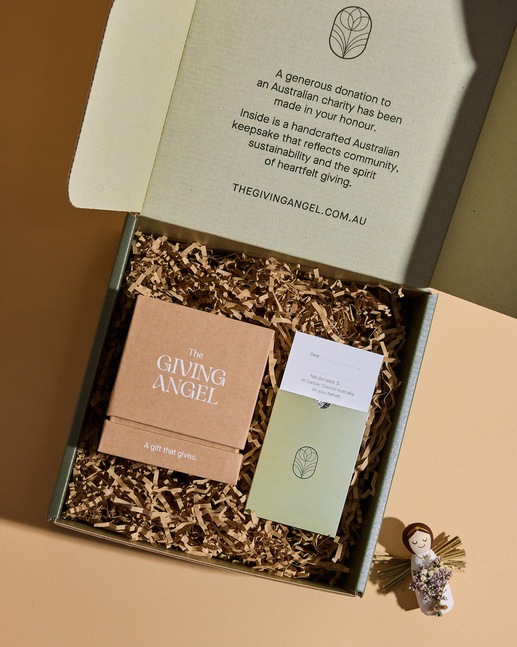 The Giving Angel charitable gift box with handcrafted angel keepsake, donation card and preserved flower bouquet.